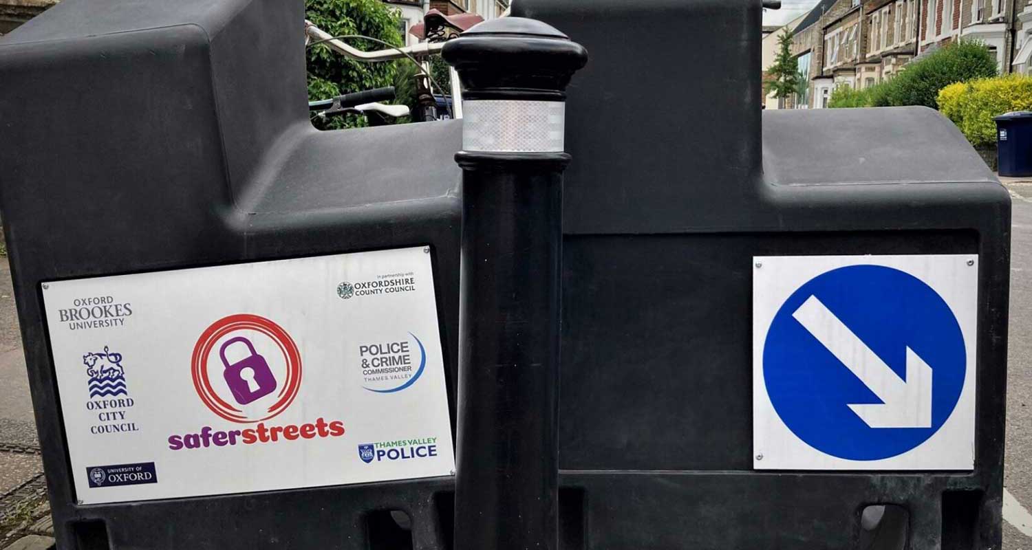 A sticker on a bikebay with various logo designs for Oxford City Council, demonstrating the effect of strong branding